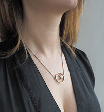 Load image into Gallery viewer, Brass Ring + Smaller Rings Necklace
